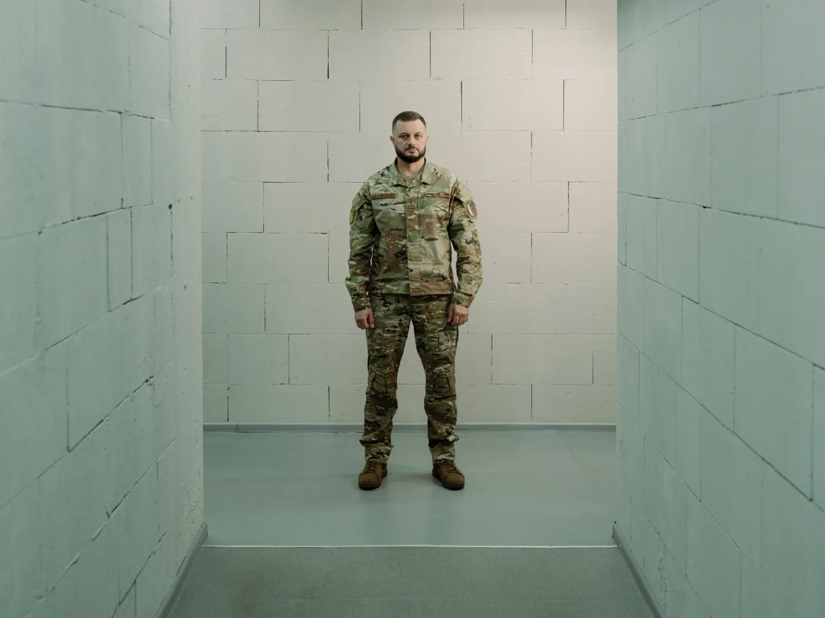 a soldier stands in a hallway