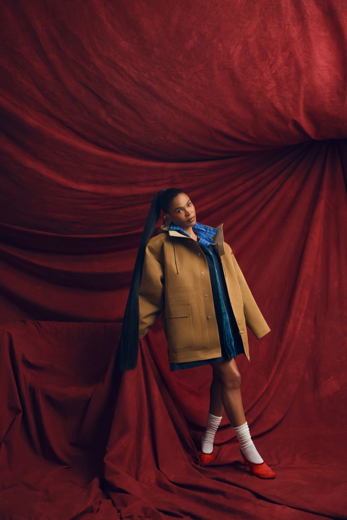 Image may contain Performer Person Solo Performance Clothing Coat Cape Face Head Photography Portrait and Adult